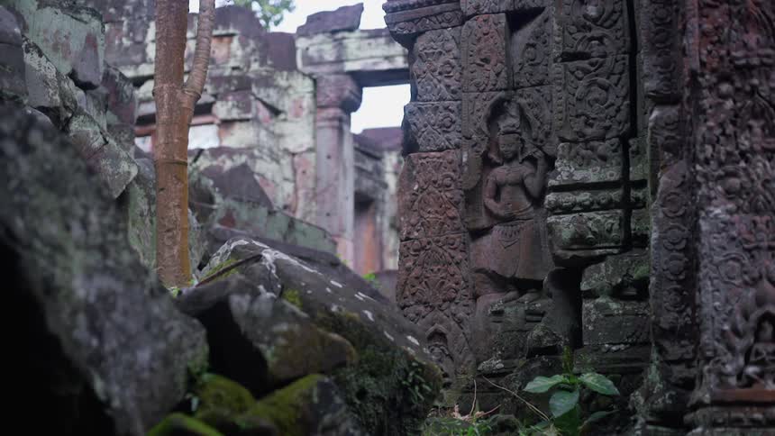 Female statue sits near the cement structure