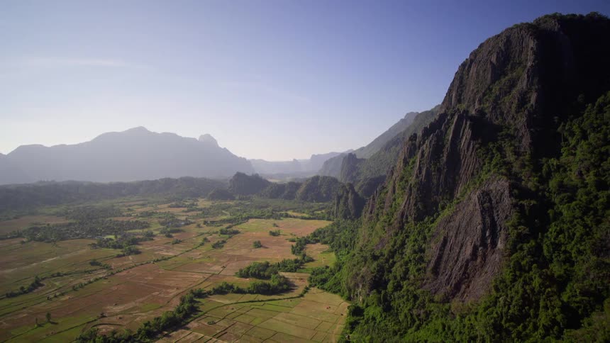 Farmland fills a mountain valley