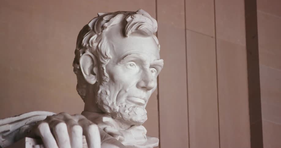 A statue of a president is displayed outdoors