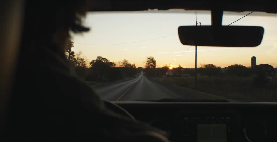 A man driving down a street