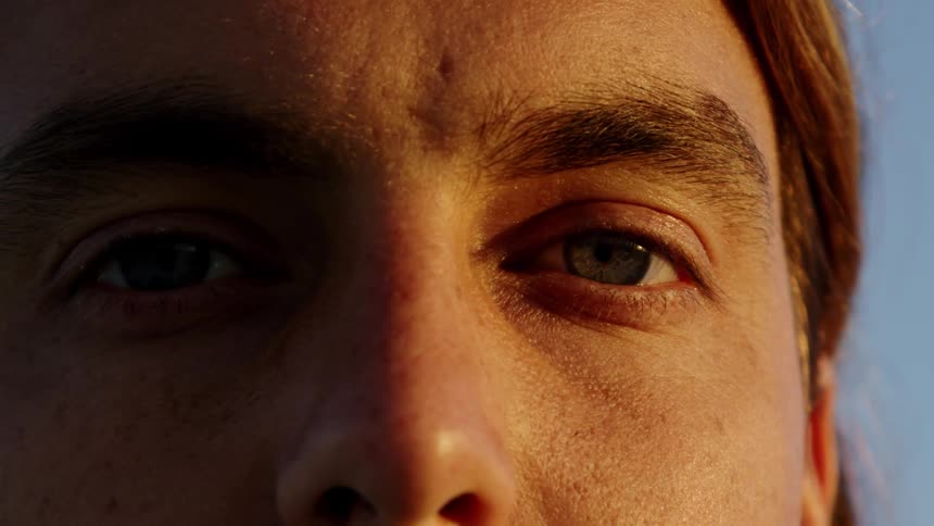 Man opens his eyes