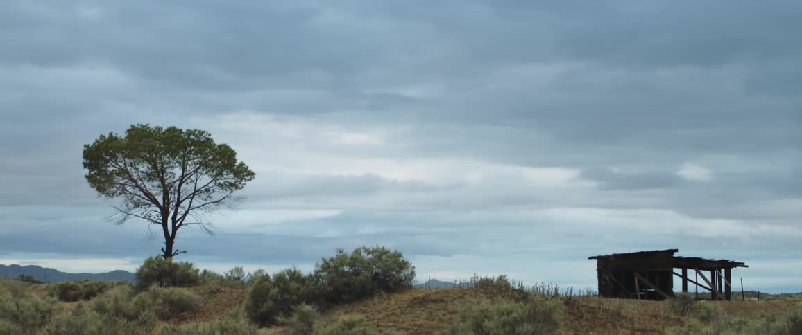View of a hut on a hill on a cloudy day