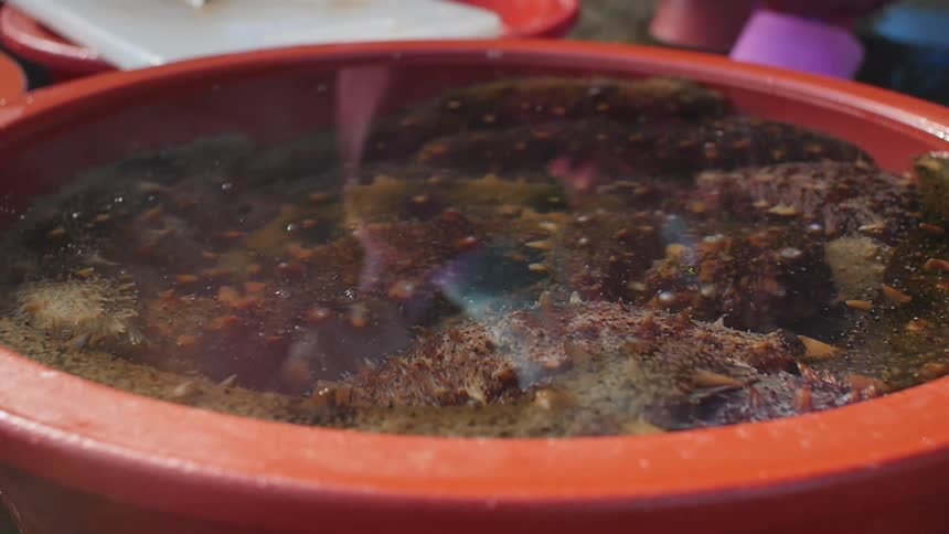 A bowl of steaming liquid