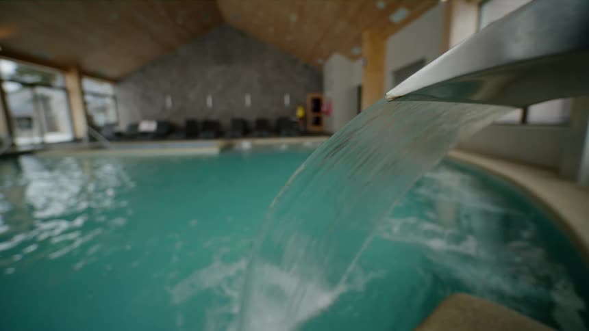 Water pouring into indoor pool