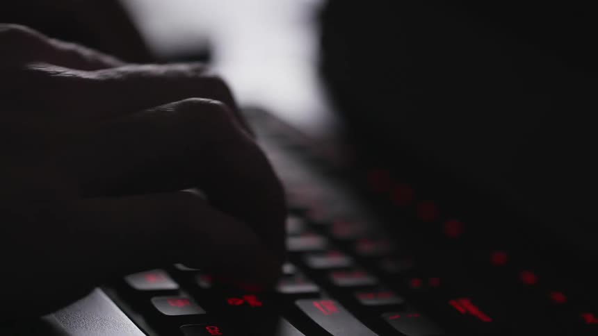 A man types on his computer