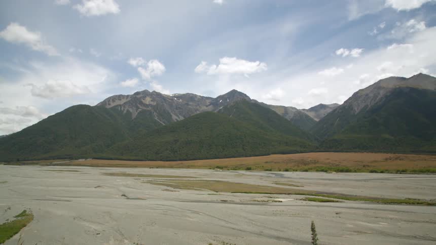 The valley is empty before the mountains