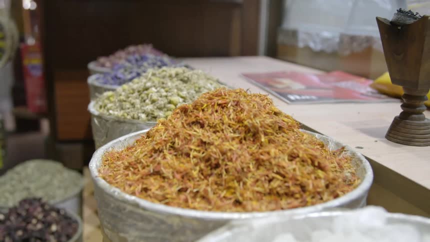 Food and grains in large open bowls on a shelf
