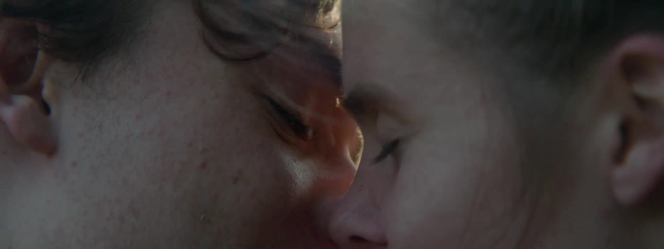 Man and woman kiss and touch each other
