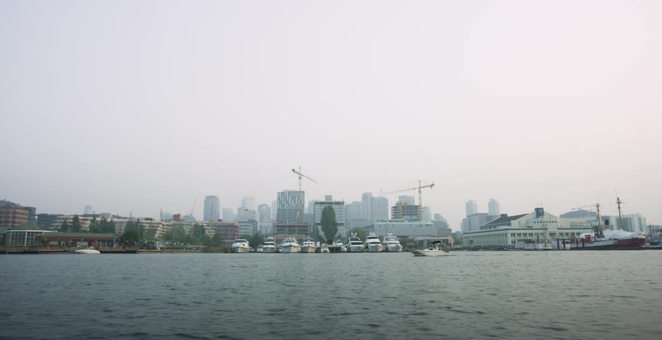 Tall buildings and sea against the sky