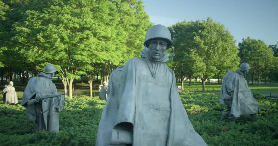 Statues of Korean War soldiers outside in a garden