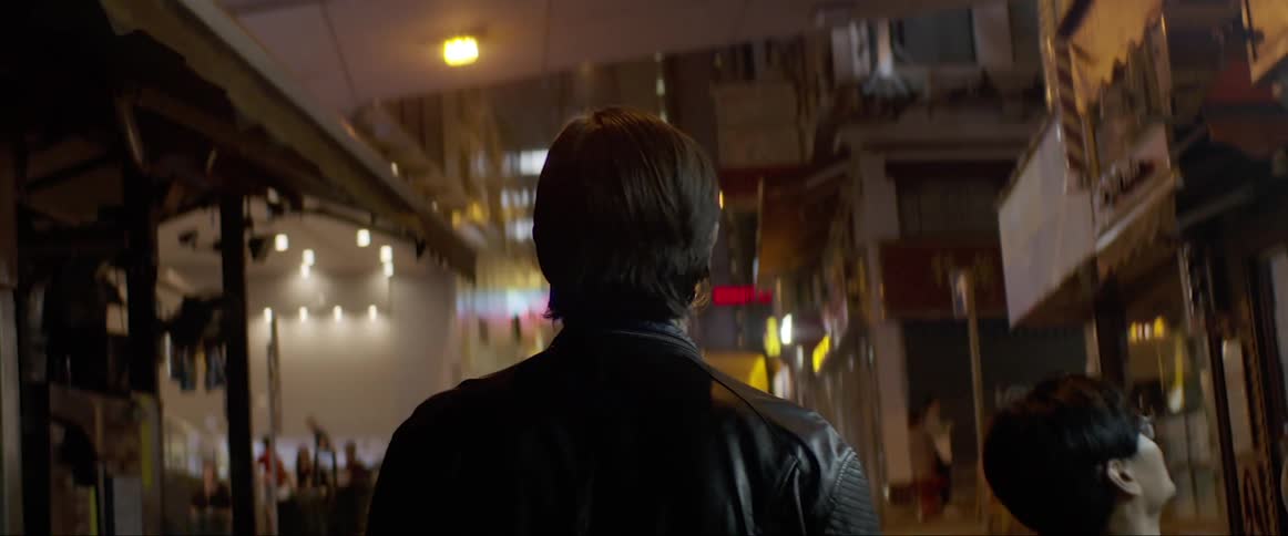 Man walks down the street at night