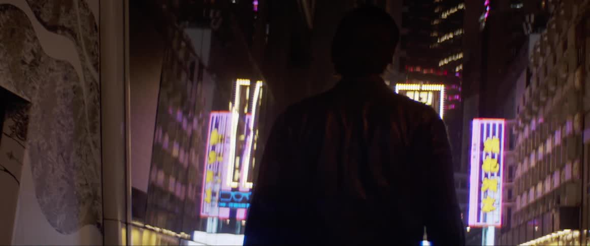 Man walks down the street in city at night