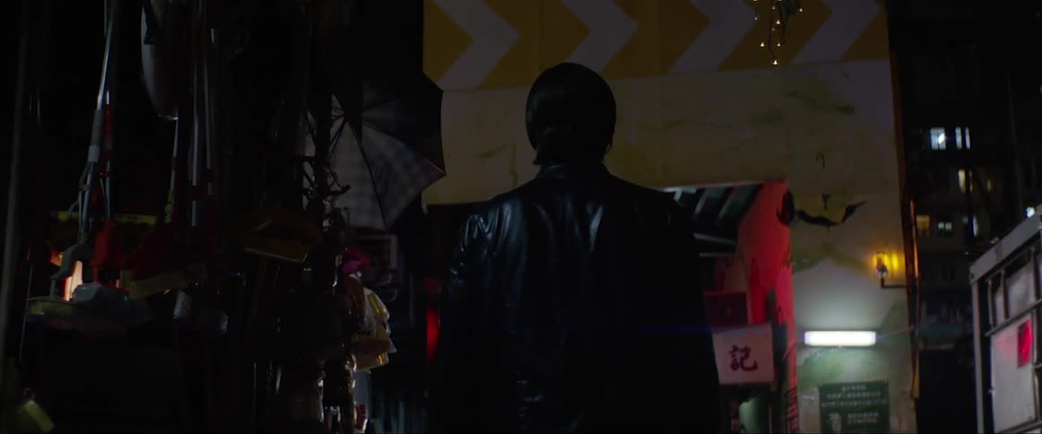Man looks at the building at night