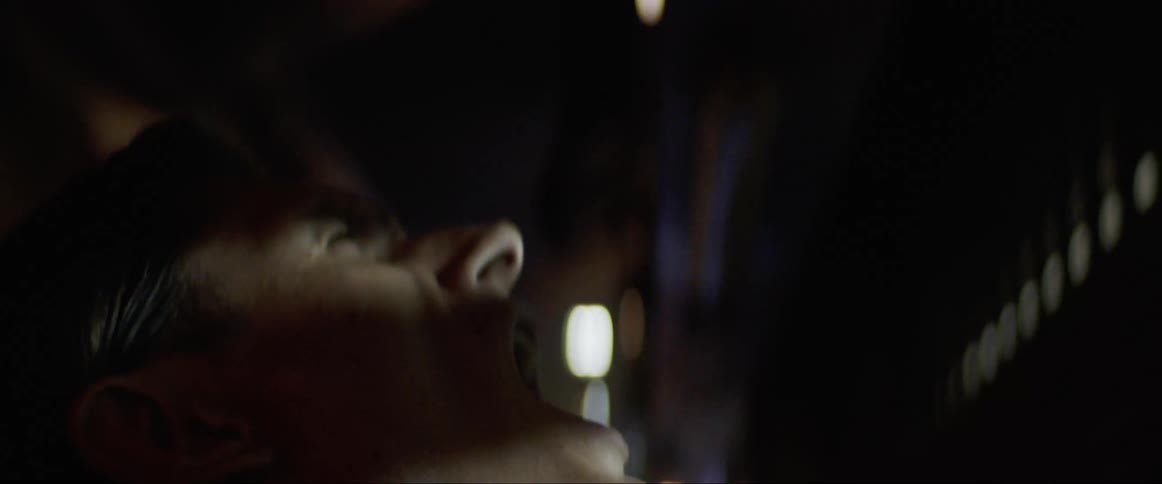 A man is screaming through the cage wall