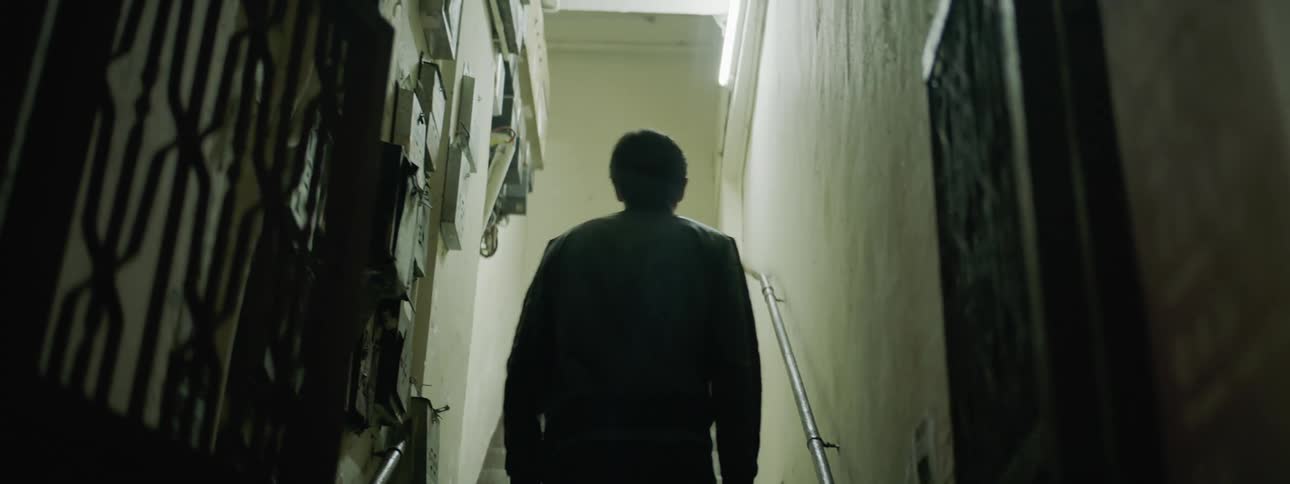 A man climbs the stairwell in the building