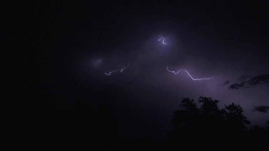 Lightning flashes in a dark sky