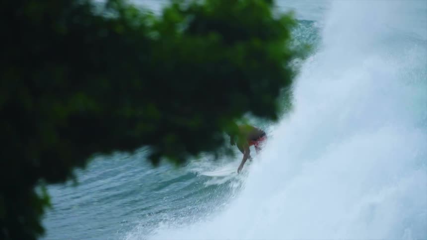 A man surfing in the ocean