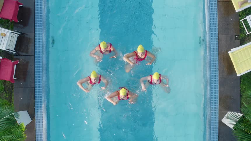 Five synchronized swimmers in a pool