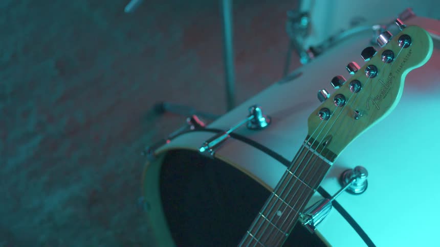 Instruments sit on display in a dark room