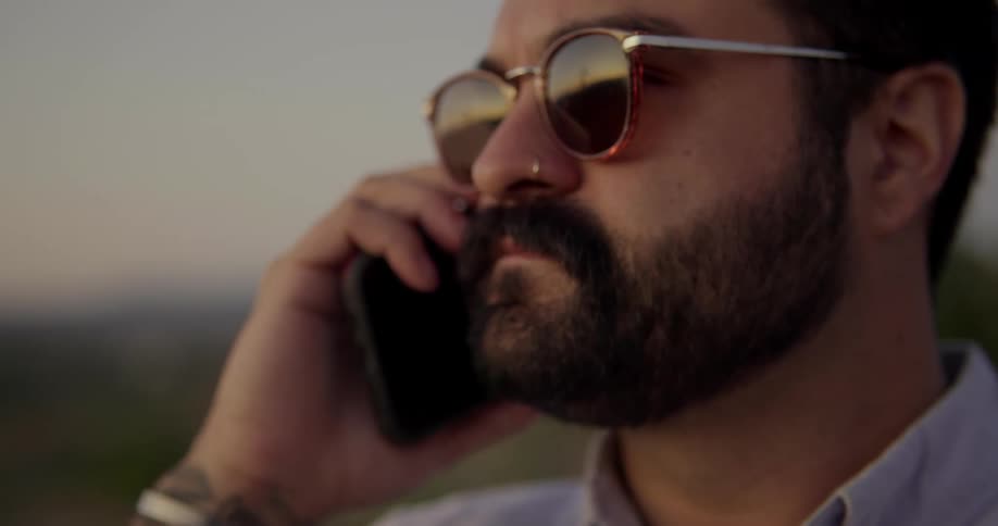 A man talks on his cellphone outside