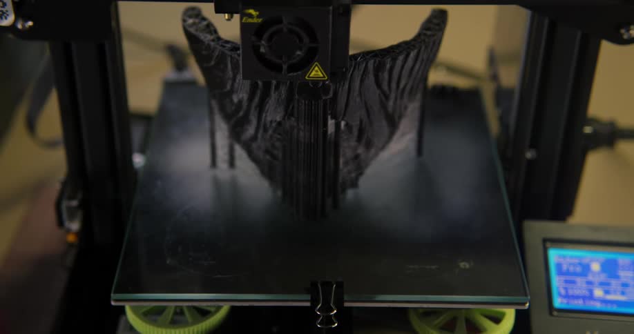 The 3d printer is creating an item