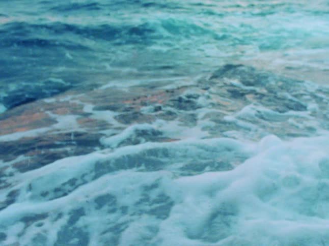 Large foamy ocean waves flow and crest