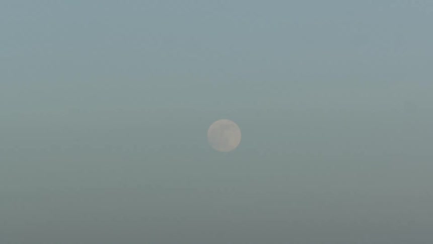 Full moon on the sky at day