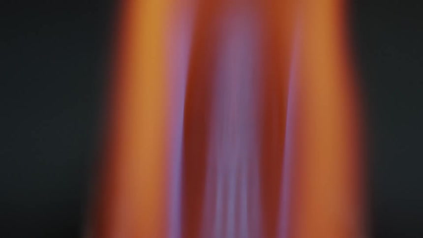 Glass heating inside a red hot flame