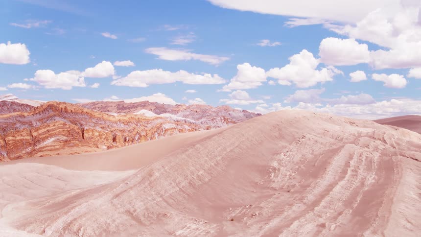 Partial clouds hover over the mountain range