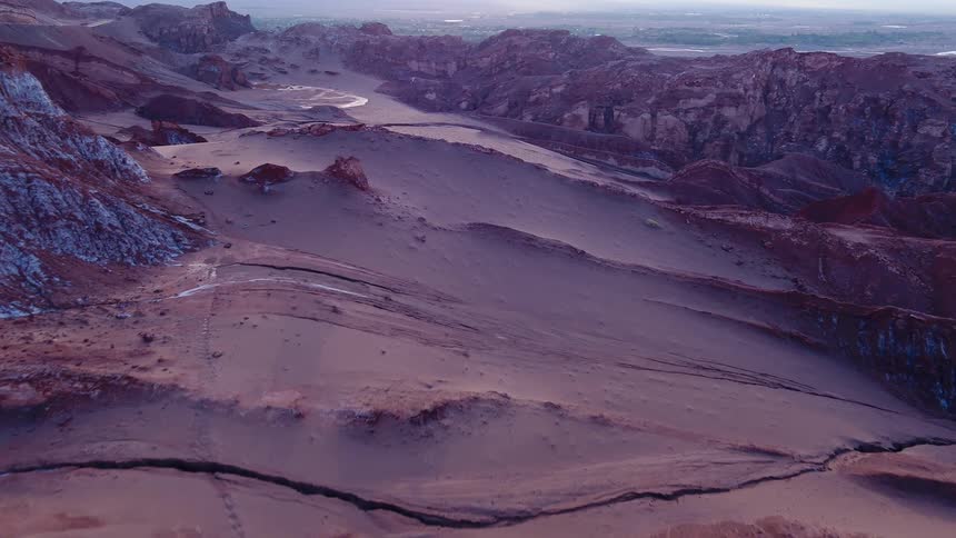 A canyon with plateaus with the sky in the background