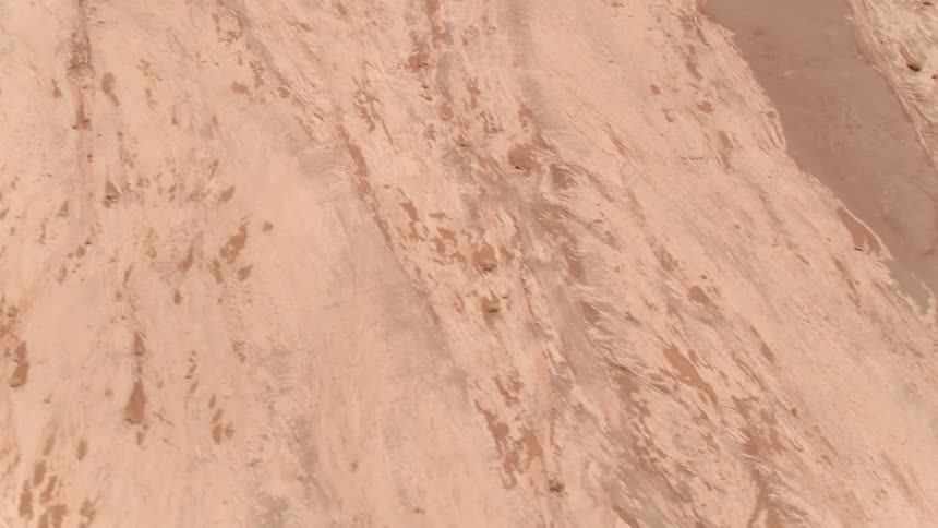 Dirtand rocks cover the side slope of a mountain