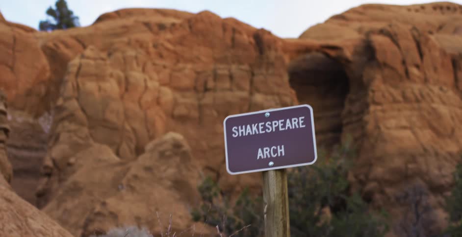 A man hikes through the badlands