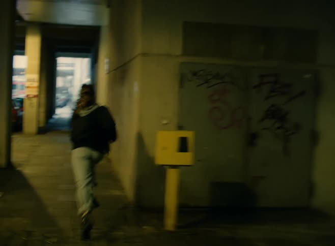 A person running down a city street