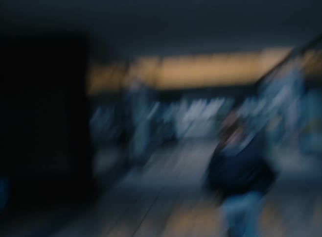 A person is running down the hall