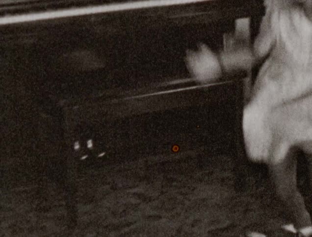 Sisters dancing and playing in a living room