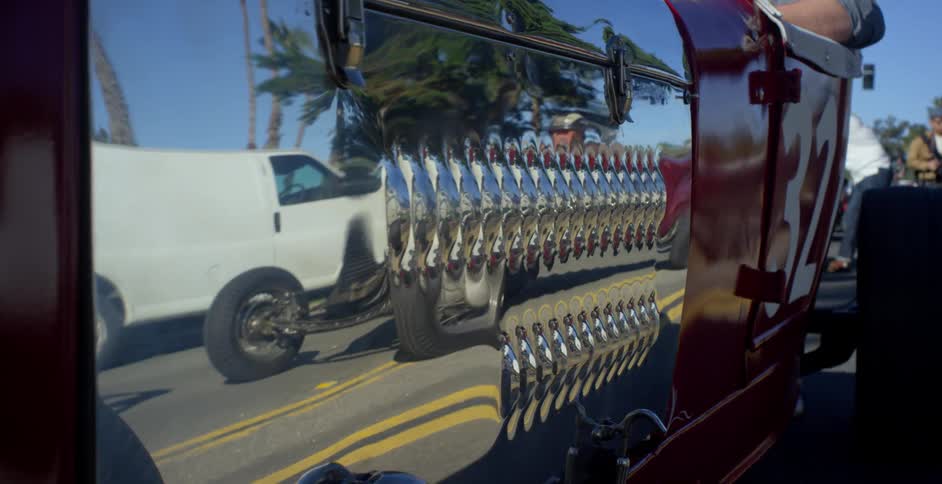 Hot rods are parked on the road