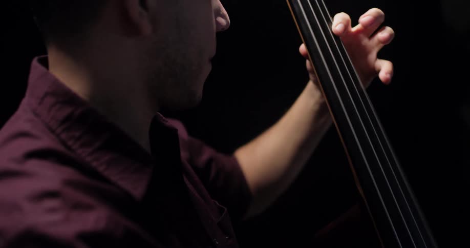 A man is performing with a musical instrument