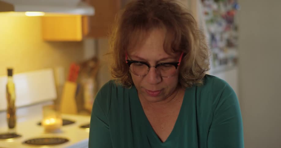A woman in her kitchen