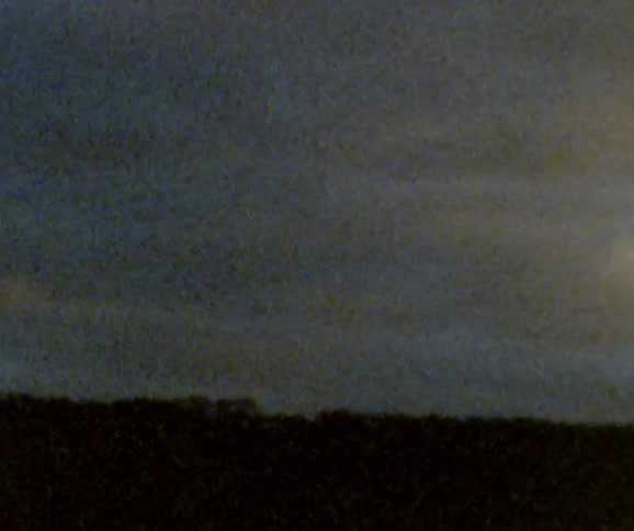 Heavy clouds cover the field