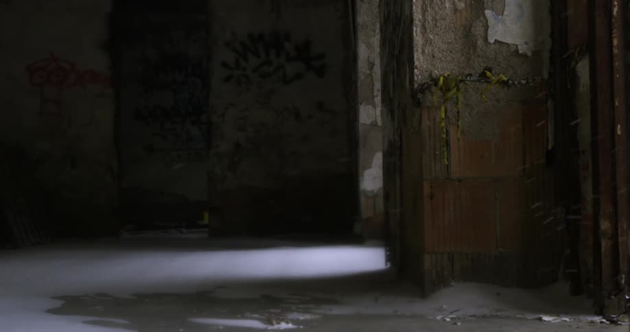 An old abandoned building with snow coming inside