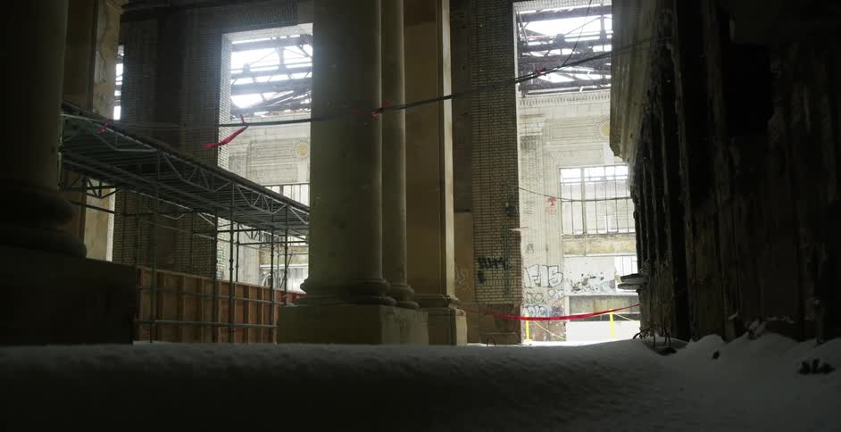 A construction area is taped off as snow blows in