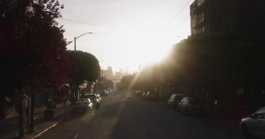 A downtown city is displayed at dusk