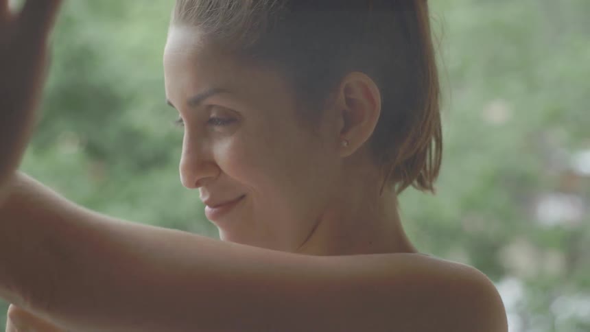 A woman practices punching and sparring outside