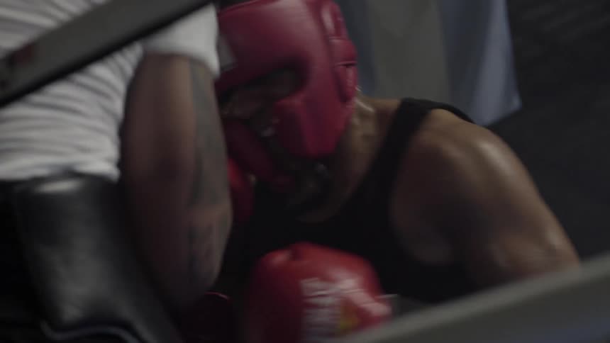 Boxers spar in a boxing ring