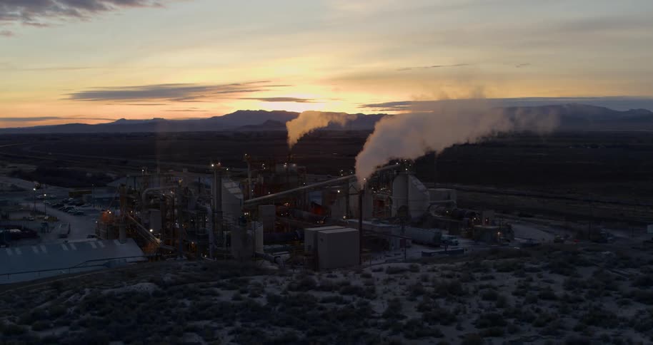 Steam rises from the plant in the desert