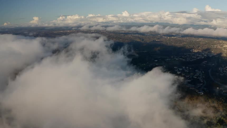 The sky is clear above the clouds