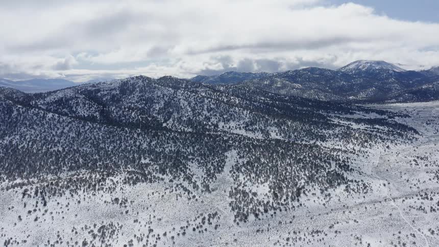 Mountains covered with snow with the sky in the background