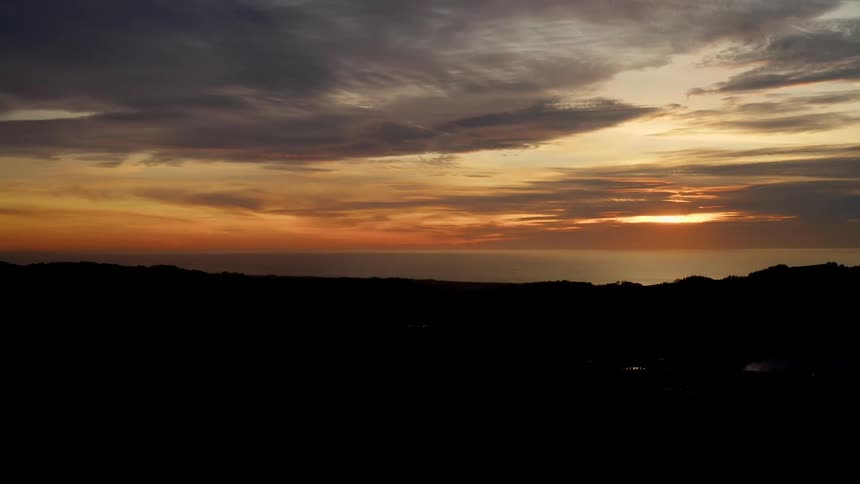 A landscape is displayed while the sun is setting