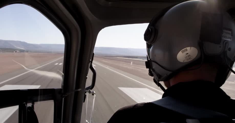 A person is driving a plane on the runway