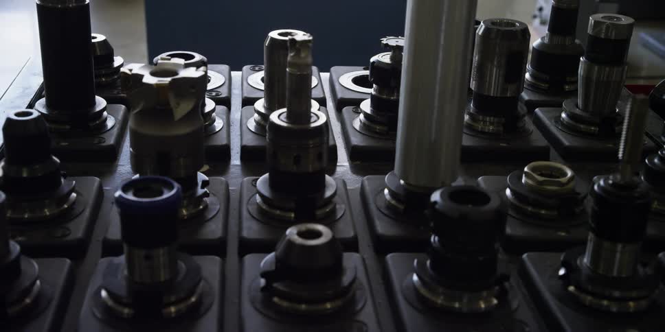 The machine sits still in the dark room